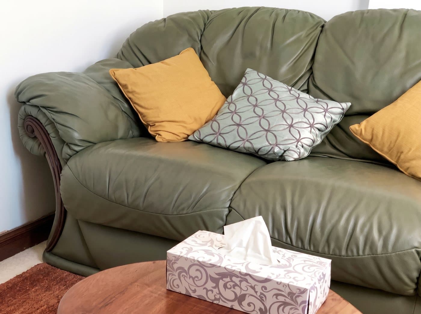 A corner of our session room: a comfortable couch and coffee table, set up for an unhurried conversation
